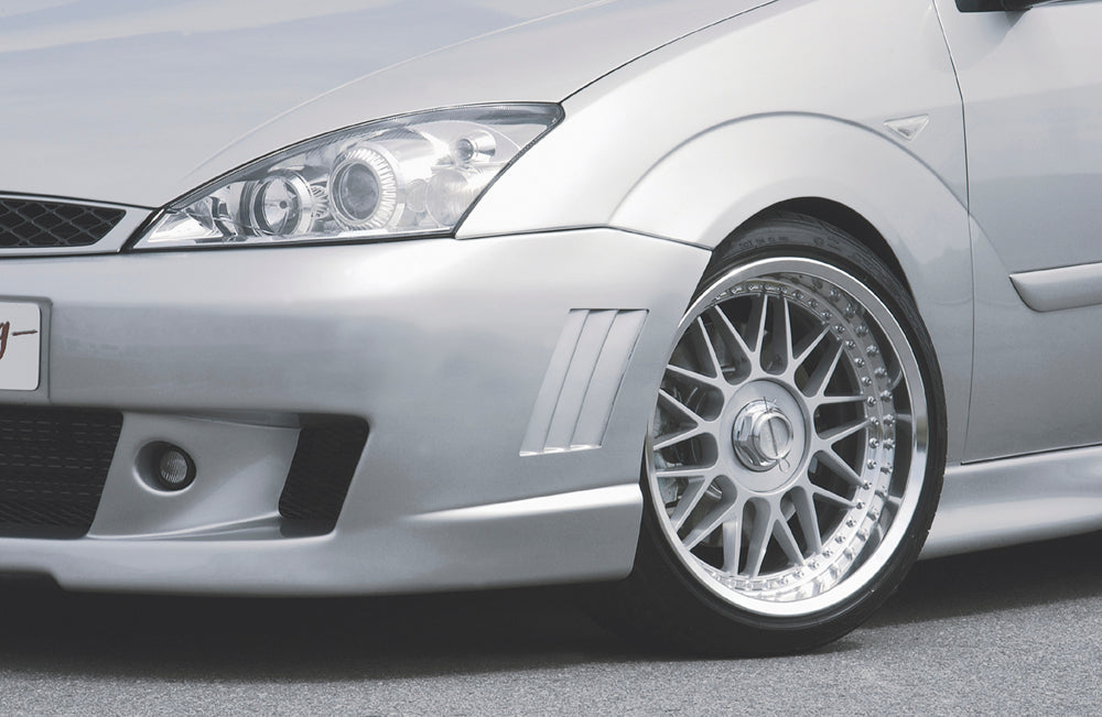 Ford Focus 1 Rieger Spoilerstoßstange ab Modell 11/2001 mit seitlichen Rippen, ABS, für Fzg. mit Scheinwerferreinigungsanlage,
inkl. Alugitter, Montagezubehör, ABE