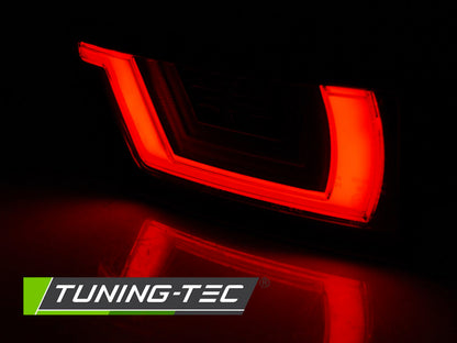 Tuning-Tec LED Lightbar Rückleuchten für Land Rover / Range Rover Evoque 11-18 rot/rauch mit dynamischem Blinker