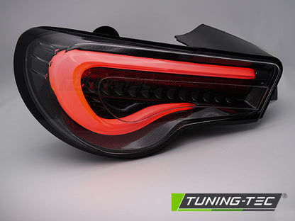 Tuning-Tec LED Lightbar Rückleuchten für Toyota GT86 12-21 schwarz/carbon mit dyn. Blinker