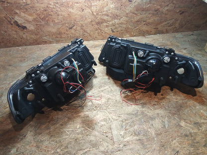 Tuning-Tec LED Angel Eyes Scheinwerfer für BMW 7er E38 94-98 schwarz (LPBM37)