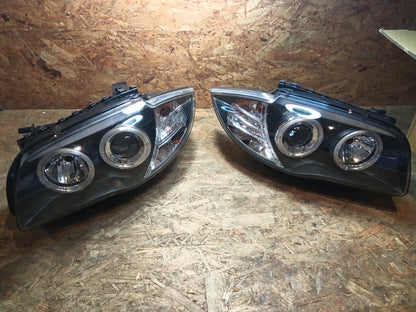 Tuning-Tec LED Angel Eyes Scheinwerfer für BMW 1er E81, E82, E87, E88 04-11 schwarz (LPBM80)