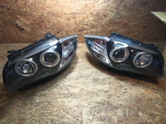 Tuning-Tec LED Angel Eyes Scheinwerfer für BMW 1er E81, E82, E87, E88 04-11 schwarz (LPBM80)