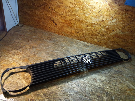 VW Polo 86C Frontgrill mit weißem Emblem original VW NEU