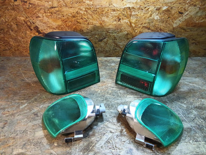 VW Polo lll 10/94-... Rückleuchtensatz mit Blinkerleuchten grün original Hella NEU