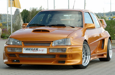 Opel Kadett E Rieger Spoilerstoßstange Breitbau II  mit Aussparung für NSW, GFK, 
Montagezubehör