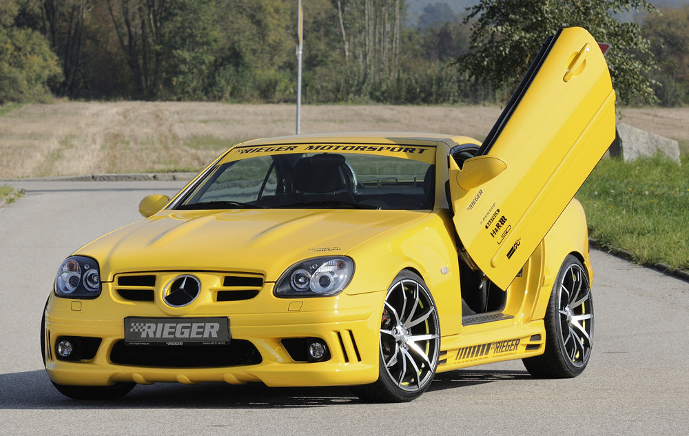 Mercedes SLK (R170) Rieger Spoilerstoßstange (orig. NSW passen nicht mehr) mit seitlichen Rippen, offen, ABS, für Fzg. mit Scheinwerferreinigungsanlage, NSW, 
inkl. Alugitter, Montagezubehör, ABE