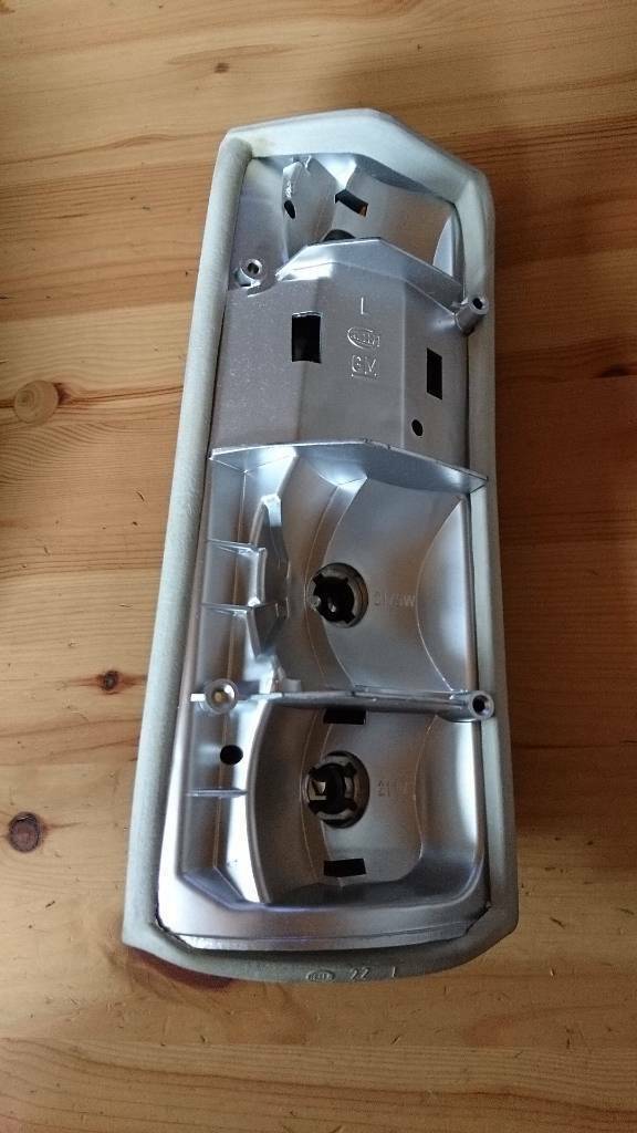 Original GM Rekord E Caravan Rückleuchte Lampenträger links Neu