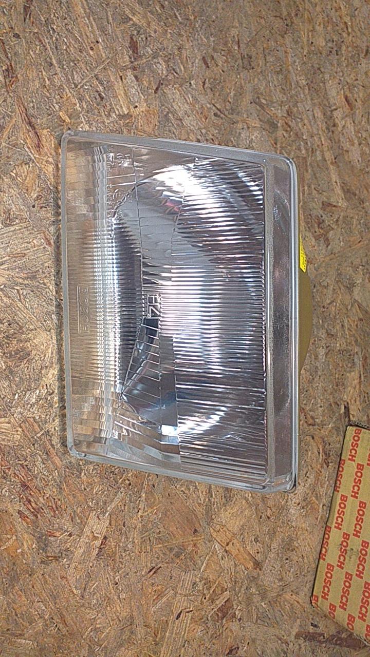 Kadett D Frontscheinwerfer H4 links original Bosch NEU