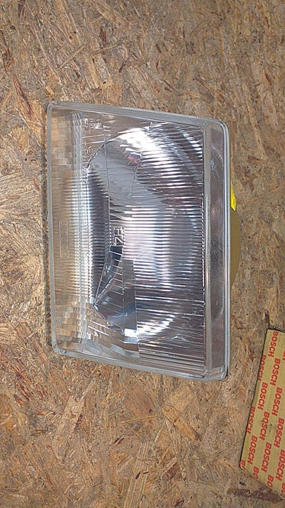 Kadett D Frontscheinwerfer H4 links original Bosch NEU