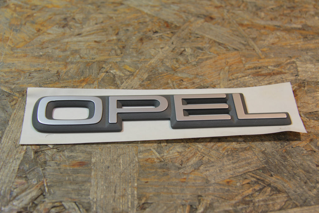 Original GM Opel OPEL- Schriftzug chrom/grau  Länge: 18 cm Breite: 3,3 cm  90227069 Kadett E